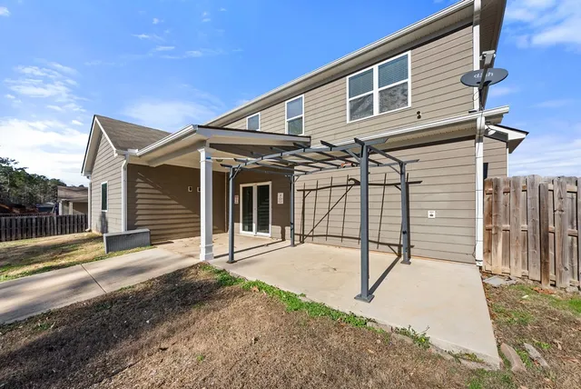 a view of a swimming pool with an outdoor space and seating area