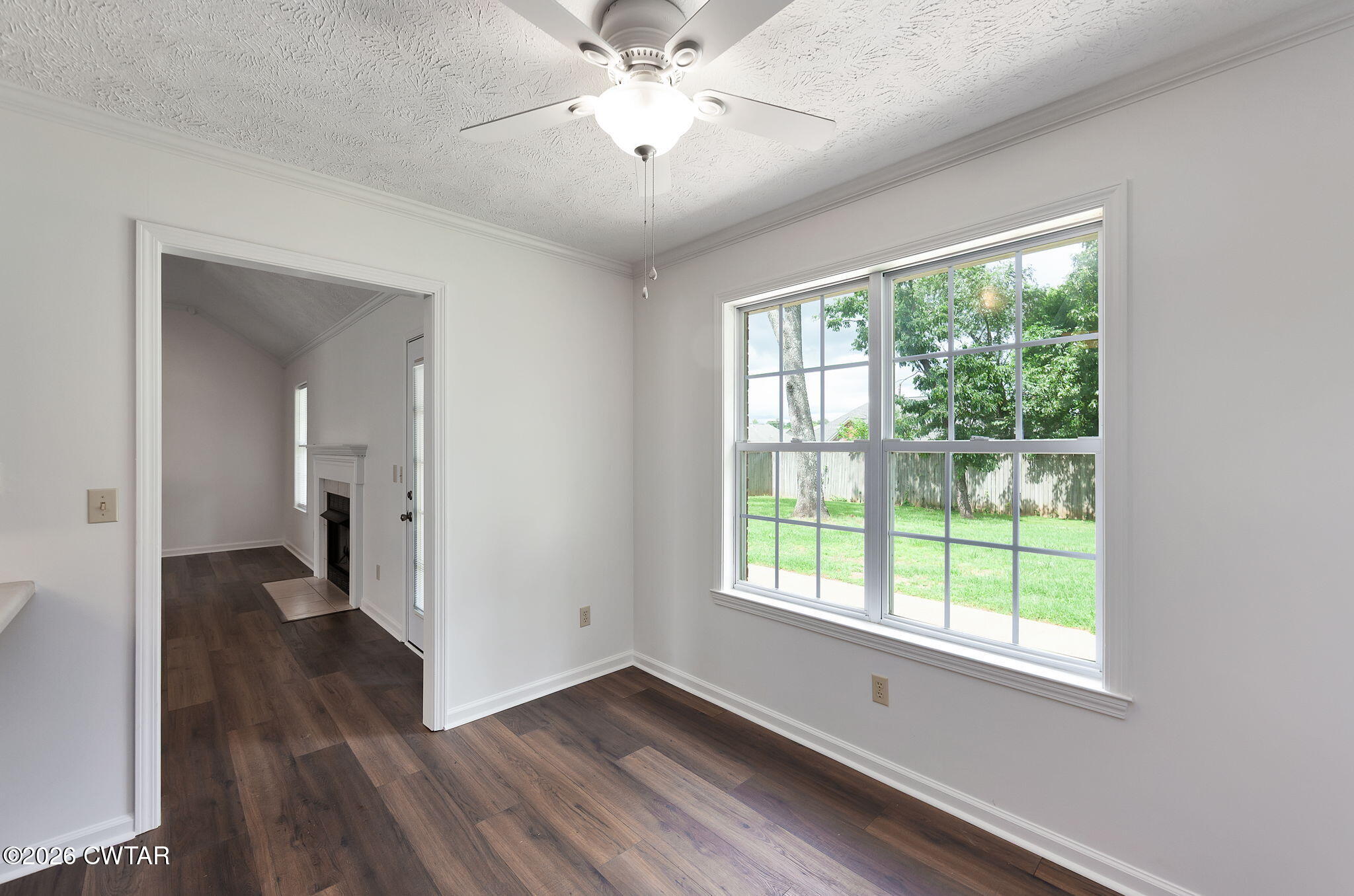 96 Sundown Drive Jackson, TN 38305 - Photo 12 of 28 a view of empty room with wooden floor and fan