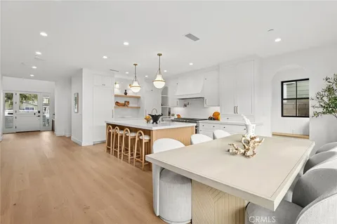 a living room with kitchen island furniture and a wooden floor