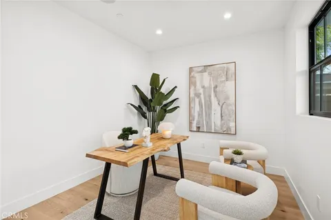 a table room with furniture and a potted plant