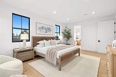 a bed room with bed and a night stand