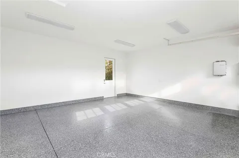 an empty room with a empty space and windows