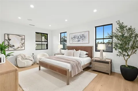 a bedroom with a large bed and a couch