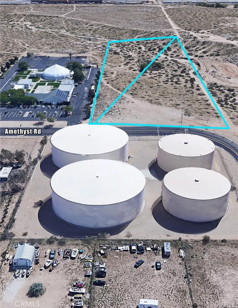 0 Amethyst Road Victorville, CA 92392 - Photo 3 of 7 a bathroom with a toilet a sink and a mirror