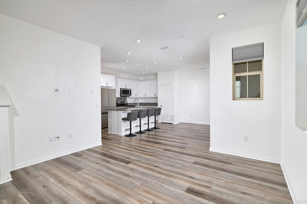 1622 Fig Tree Way Oceanside, CA 92056 - Photo 13 of 48 a view of kitchen with cabinets and wooden floor