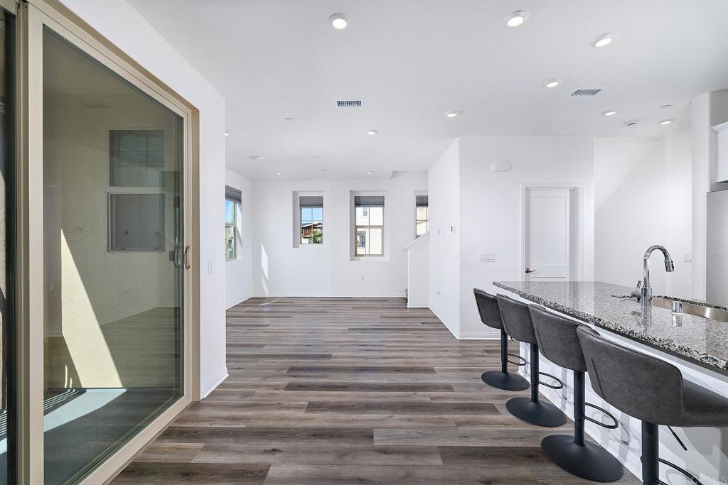 1622 Fig Tree Way Oceanside, CA 92056 - Photo 20 of 48 a view of a room with wooden floor and furniture