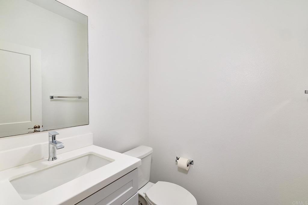 1622 Fig Tree Way Oceanside, CA 92056 - Photo 21 of 48 a bathroom with a sink mirror and toilet