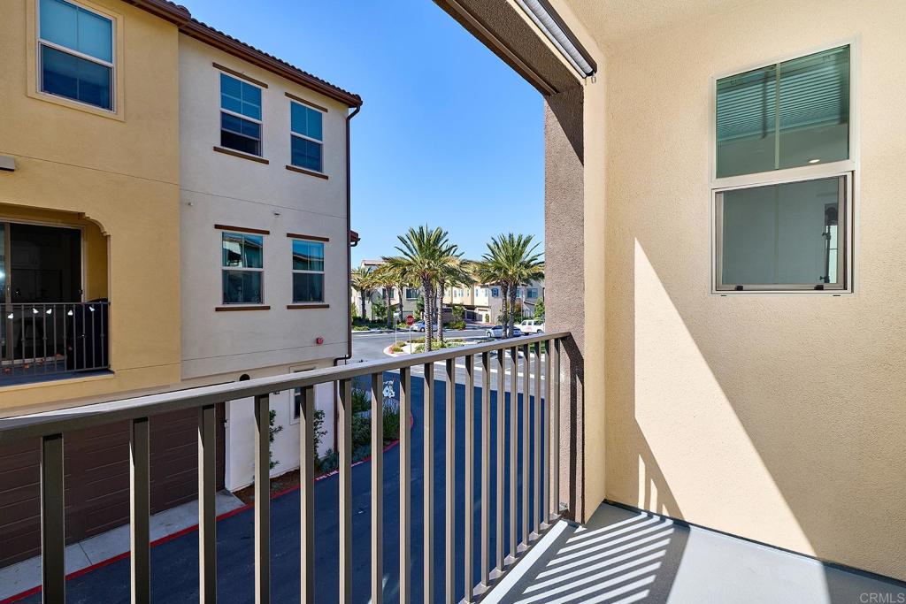 1622 Fig Tree Way Oceanside, CA 92056 - Photo 22 of 48 a view of a balcony with wooden floor and stairs