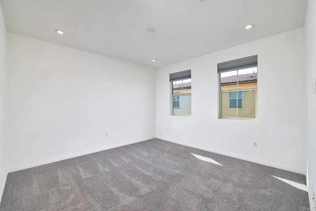 1622 Fig Tree Way Oceanside, CA 92056 - Photo 25 of 48 an empty room with windows