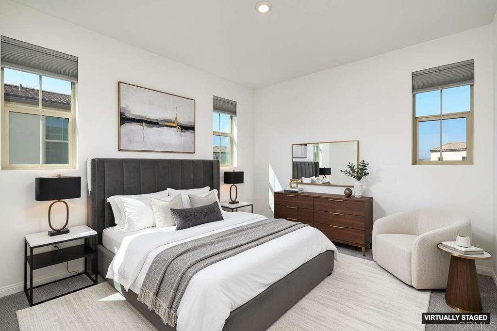 1622 Fig Tree Way Oceanside, CA 92056 - Photo 27 of 48 a bedroom with a bed and a couch