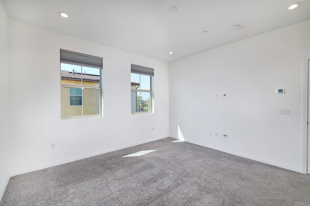 1622 Fig Tree Way Oceanside, CA 92056 - Photo 28 of 48 an empty room with windows