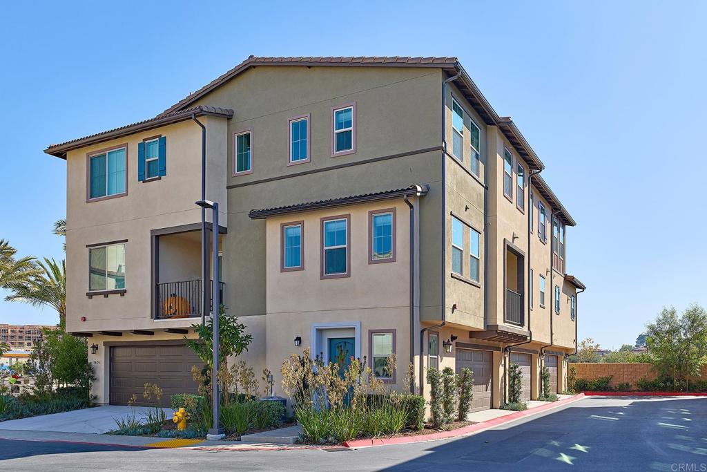 1622 Fig Tree Way Oceanside, CA 92056 - Photo 3 of 48 a front view of a house with a yard