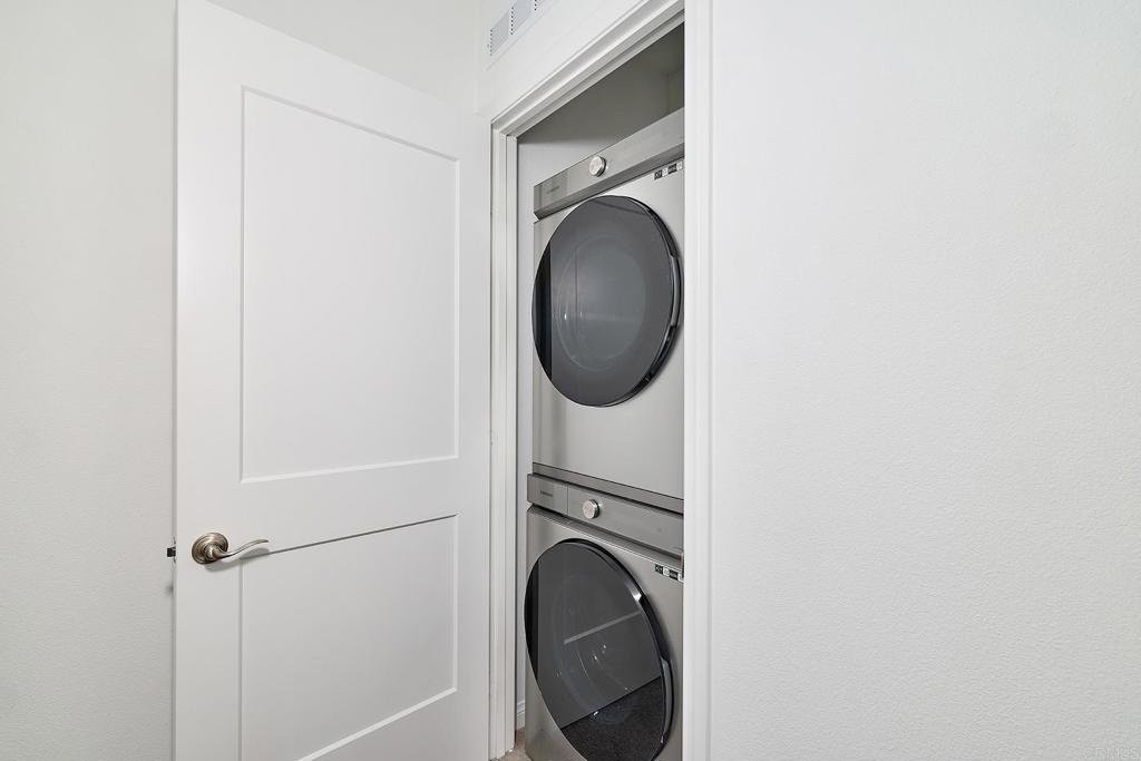 1622 Fig Tree Way Oceanside, CA 92056 - Photo 32 of 48 a close view of a utility room with dryer and washer