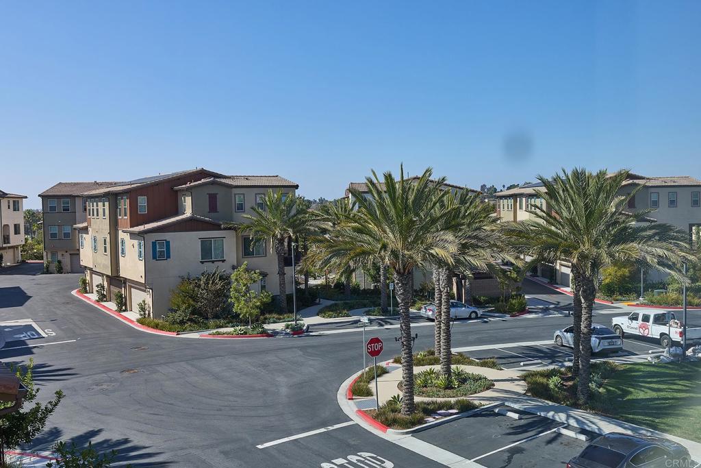 1622 Fig Tree Way Oceanside, CA 92056 - Photo 35 of 48 a view of a street with a building in the background