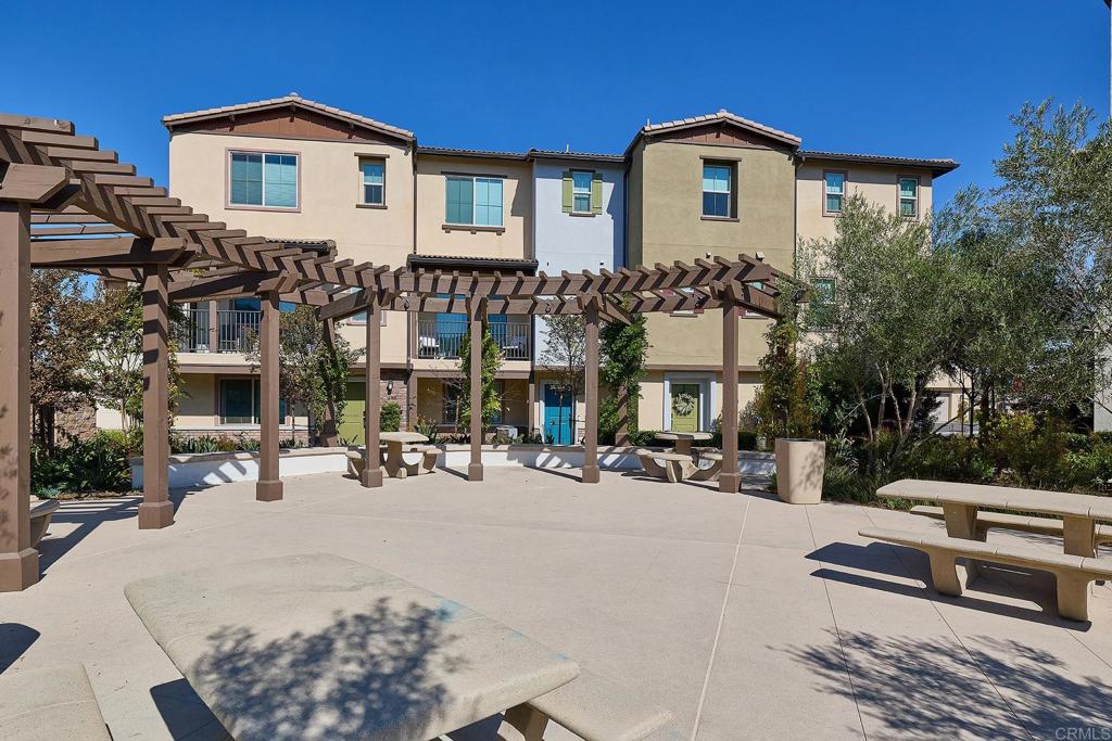 1622 Fig Tree Way Oceanside, CA 92056 - Photo 39 of 48 a view of a building with a bench in front of building