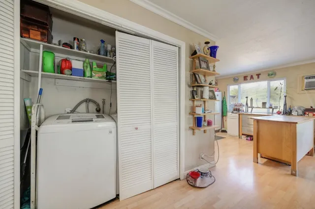 a view of storage and utility room with washer and dryer