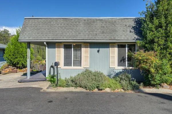 a view of a livingroom with furniture and a flat screen tv