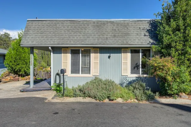 front view of a house with a bench