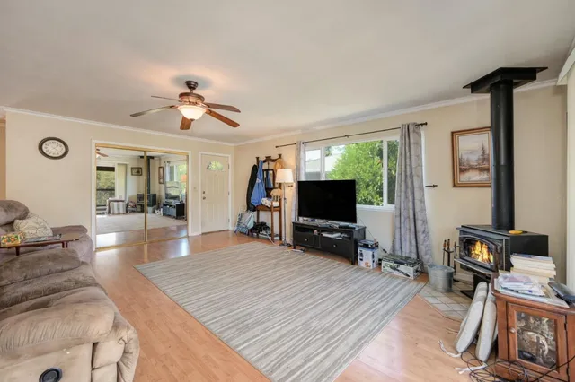 a living room with furniture and kitchen view