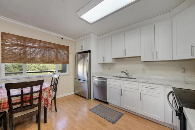 a kitchen with a refrigerator stove and microwave