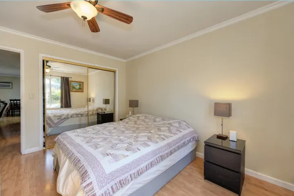 a view of a swimming pool with sitting area and furniture