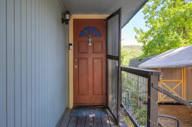 a view of a porch with wooden floor and outdoor space
