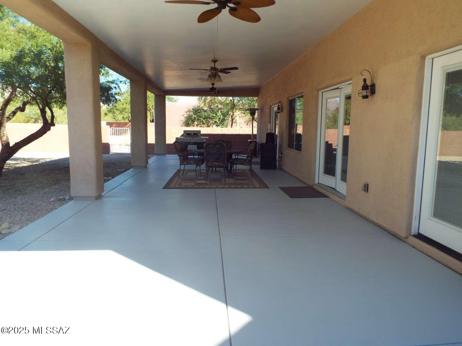 11553 East Tanque Verde Road Tucson, AZ 85749 - Photo 10 of 16 a living room with furniture and a large window