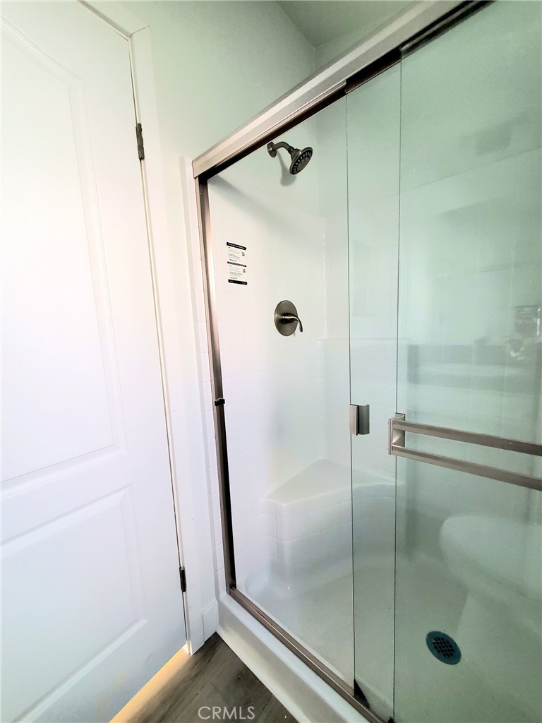 8100 Foothill Boulevard, Unit 3 Sunland, CA 91040 - Photo 11 of 14 a bathroom with a glass shower door