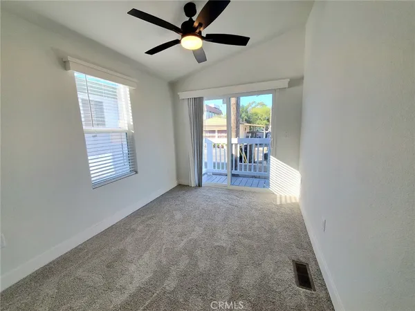 a view of livingroom with furniture and a ceiling fan