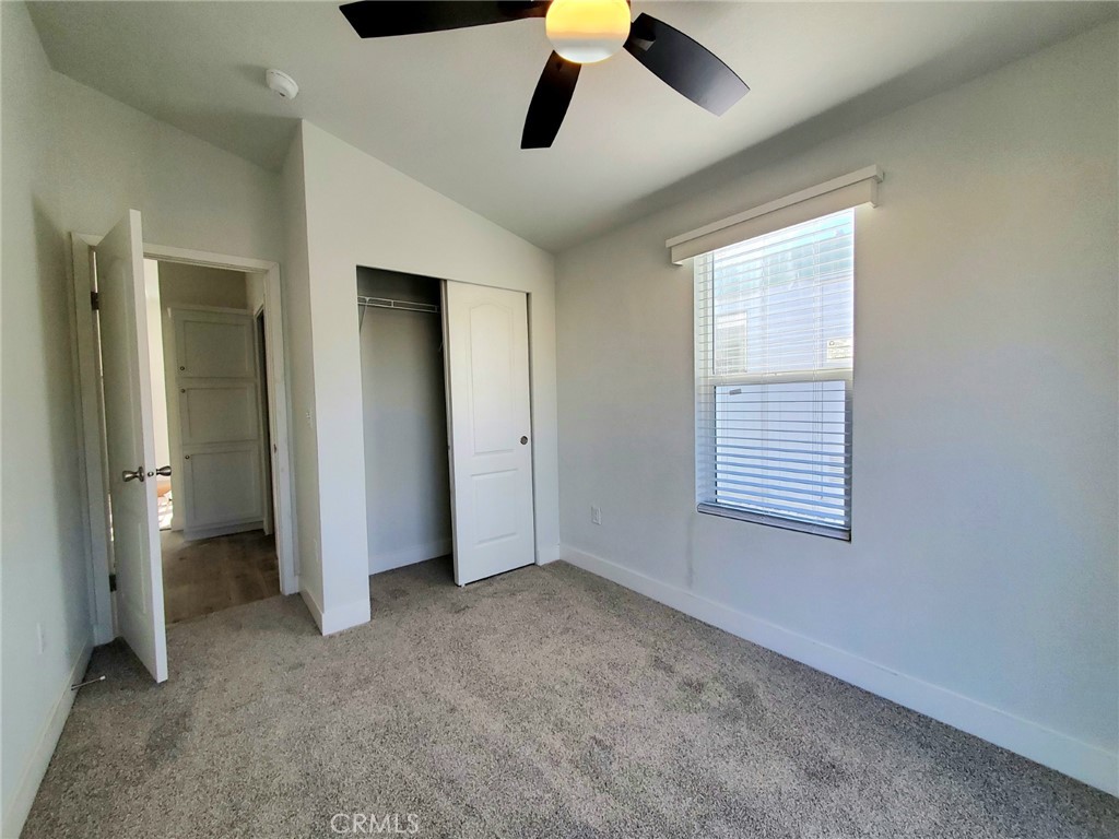 8100 Foothill Boulevard, Unit 3 Sunland, CA 91040 - Photo 13 of 14 an empty room with chandelier fan and windows