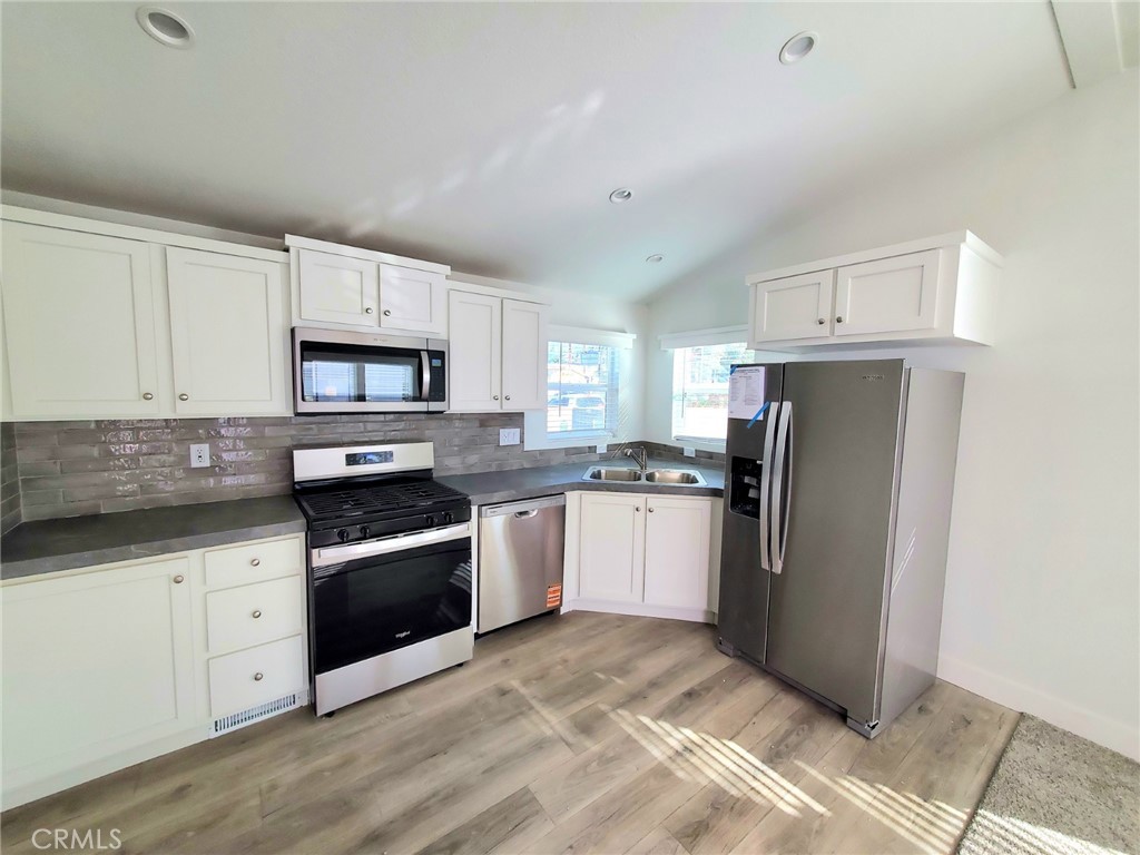8100 Foothill Boulevard, Unit 3 Sunland, CA 91040 - Photo 6 of 14 a kitchen with granite countertop a refrigerator stove and sink