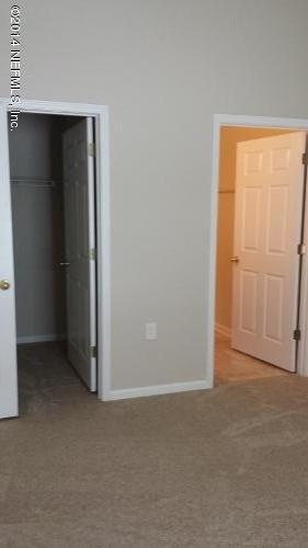 7920 Merrill Road, Unit 1407 Jacksonville, FL 32277 - Photo 5 of 7 an empty room with closet