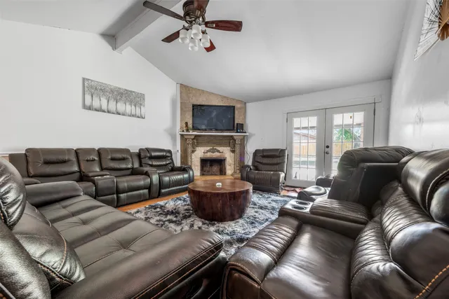 a living room with furniture and a fireplace