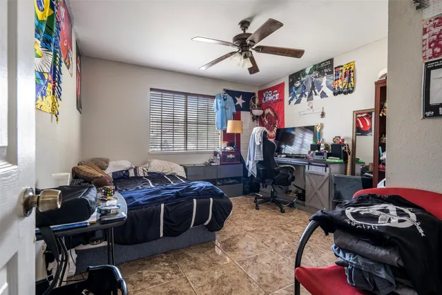 a bed room with furniture and a window