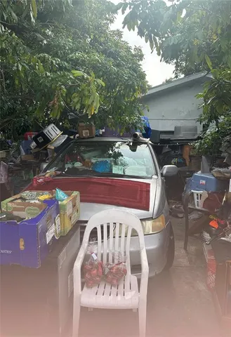 a view of a chairs and table in the patio
