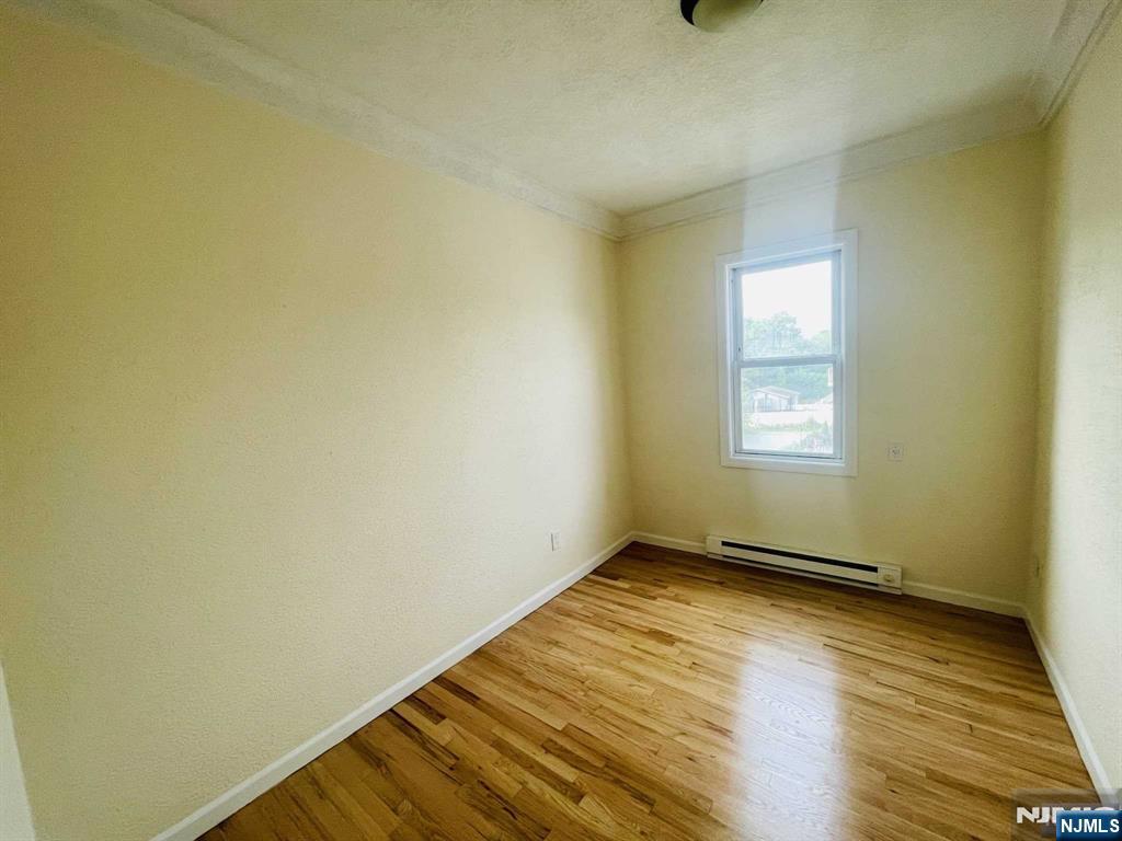 229 Orient Way, Unit 3 Rutherford, NJ 07070 - Photo 11 of 22 a view of an empty room and window