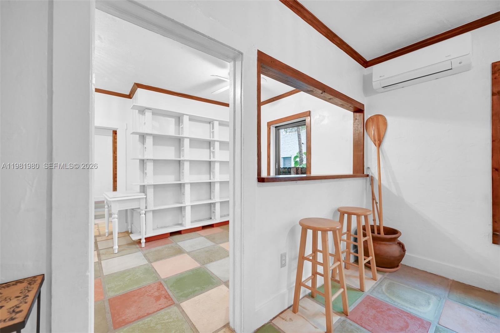 528 Northwest 47th Street, Unit 2 Miami, FL 33127 - Photo 11 of 34 a room with furniture and wooden floor