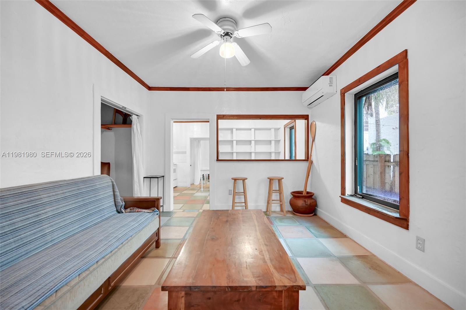 528 Northwest 47th Street, Unit 2 Miami, FL 33127 - Photo 12 of 34 a living room with furniture and a large window