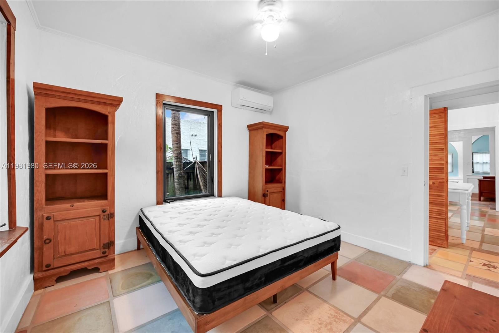 528 Northwest 47th Street, Unit 2 Miami, FL 33127 - Photo 19 of 34 a room with pool table and window