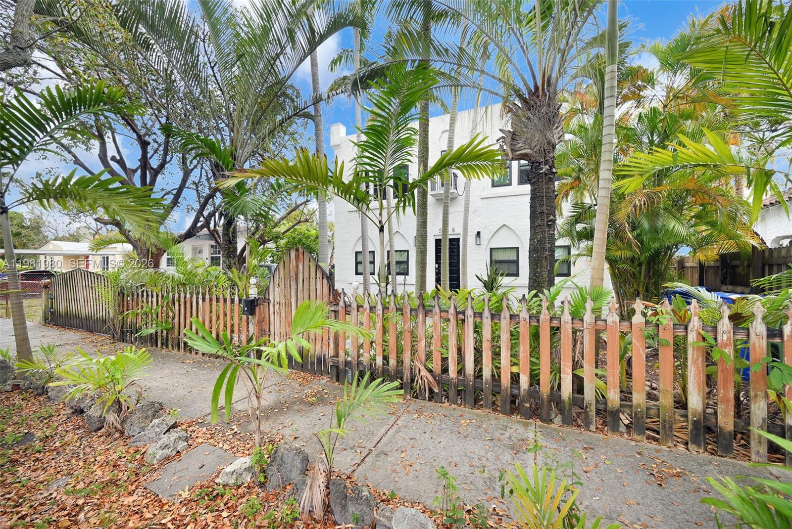 528 Northwest 47th Street, Unit 2 Miami, FL 33127 - Photo 21 of 34 a front view of a house with a garden
