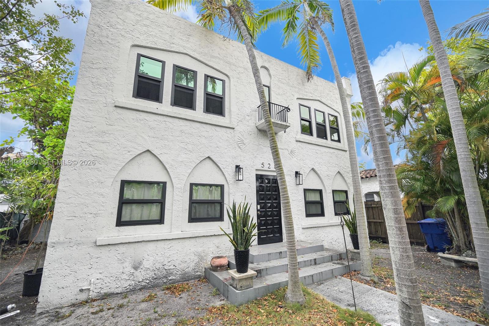 528 Northwest 47th Street, Unit 2 Miami, FL 33127 - Photo 29 of 34 a front view of a house with garden