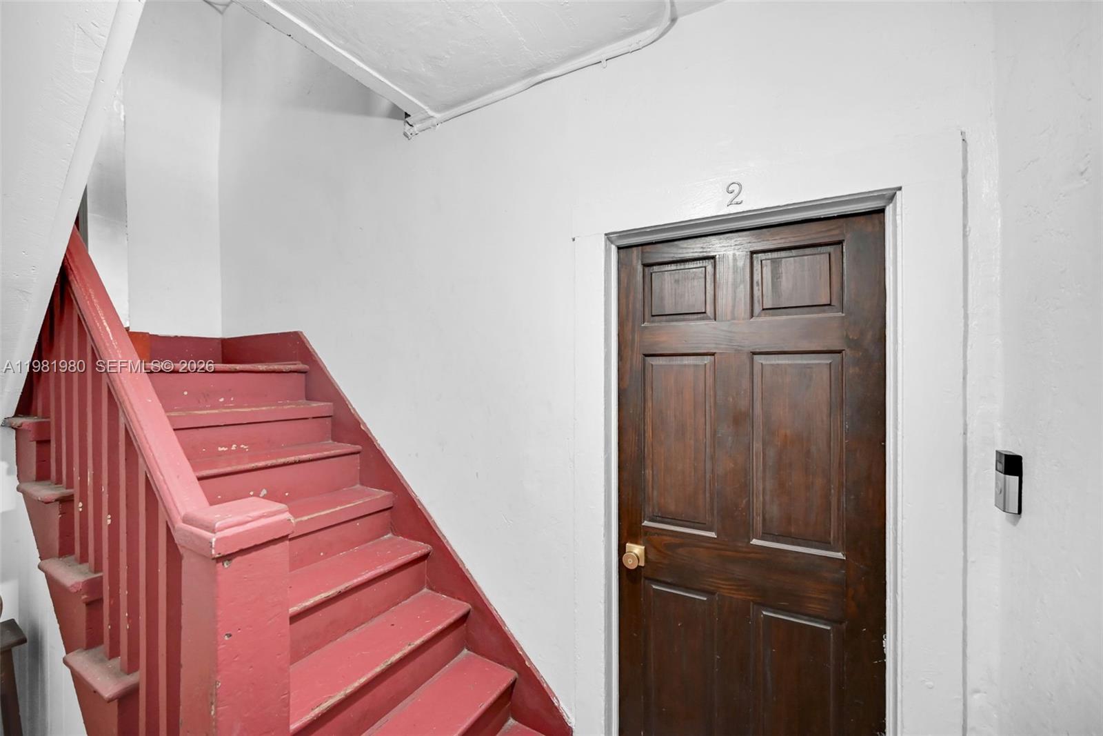 528 Northwest 47th Street, Unit 2 Miami, FL 33127 - Photo 30 of 34 a view of a hallway with front door