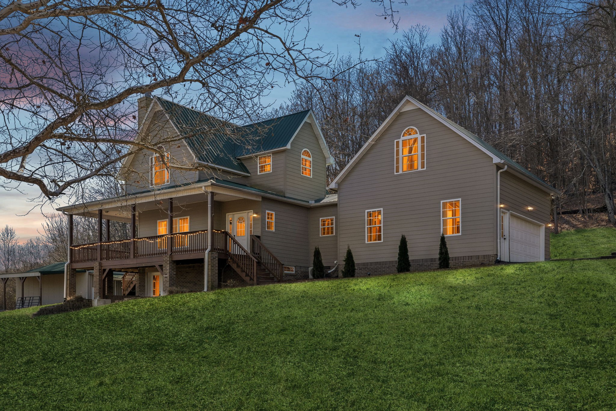 1909 Evergreen Road Thompson's Station, TN 37179 - Photo 1 of 75 a front view of a house with a yard and garage