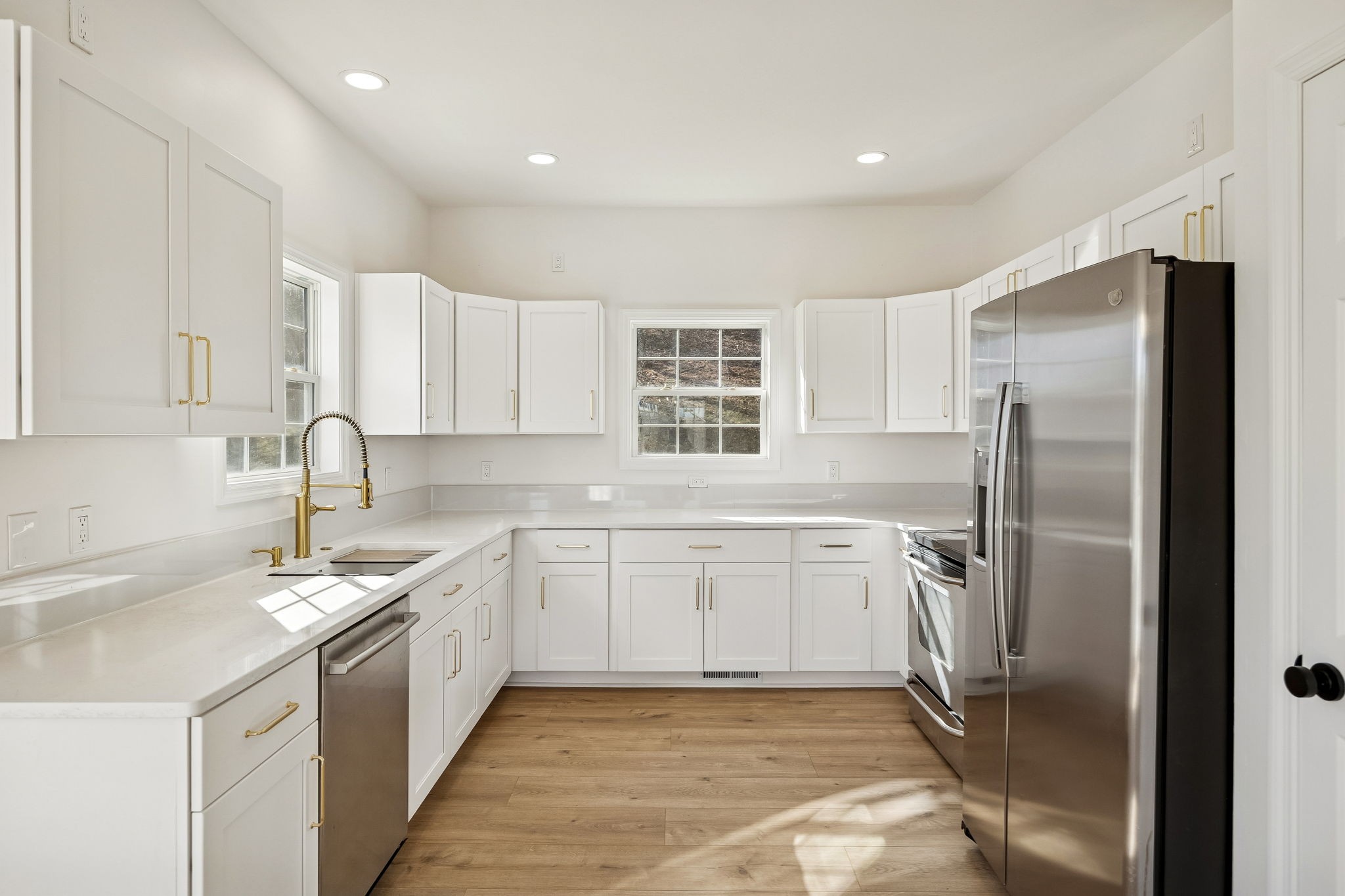 1909 Evergreen Road Thompson's Station, TN 37179 - Photo 16 of 75 a kitchen with a sink refrigerator and cabinets