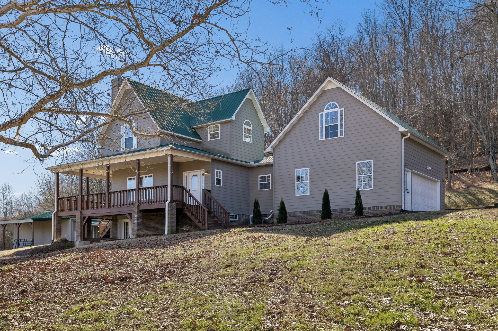 1909 Evergreen Road Thompson's Station, TN 37179 - Photo 3 of 75 a front view of a house with a yard