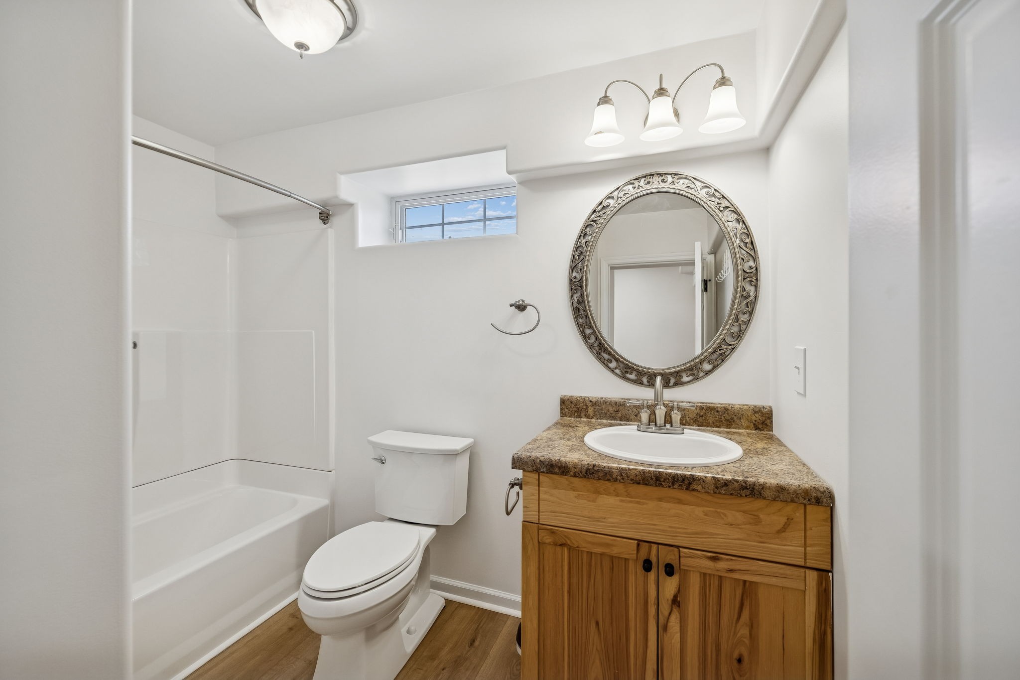 1909 Evergreen Road Thompson's Station, TN 37179 - Photo 48 of 75 a bathroom with a granite countertop sink toilet mirror vanity and shower