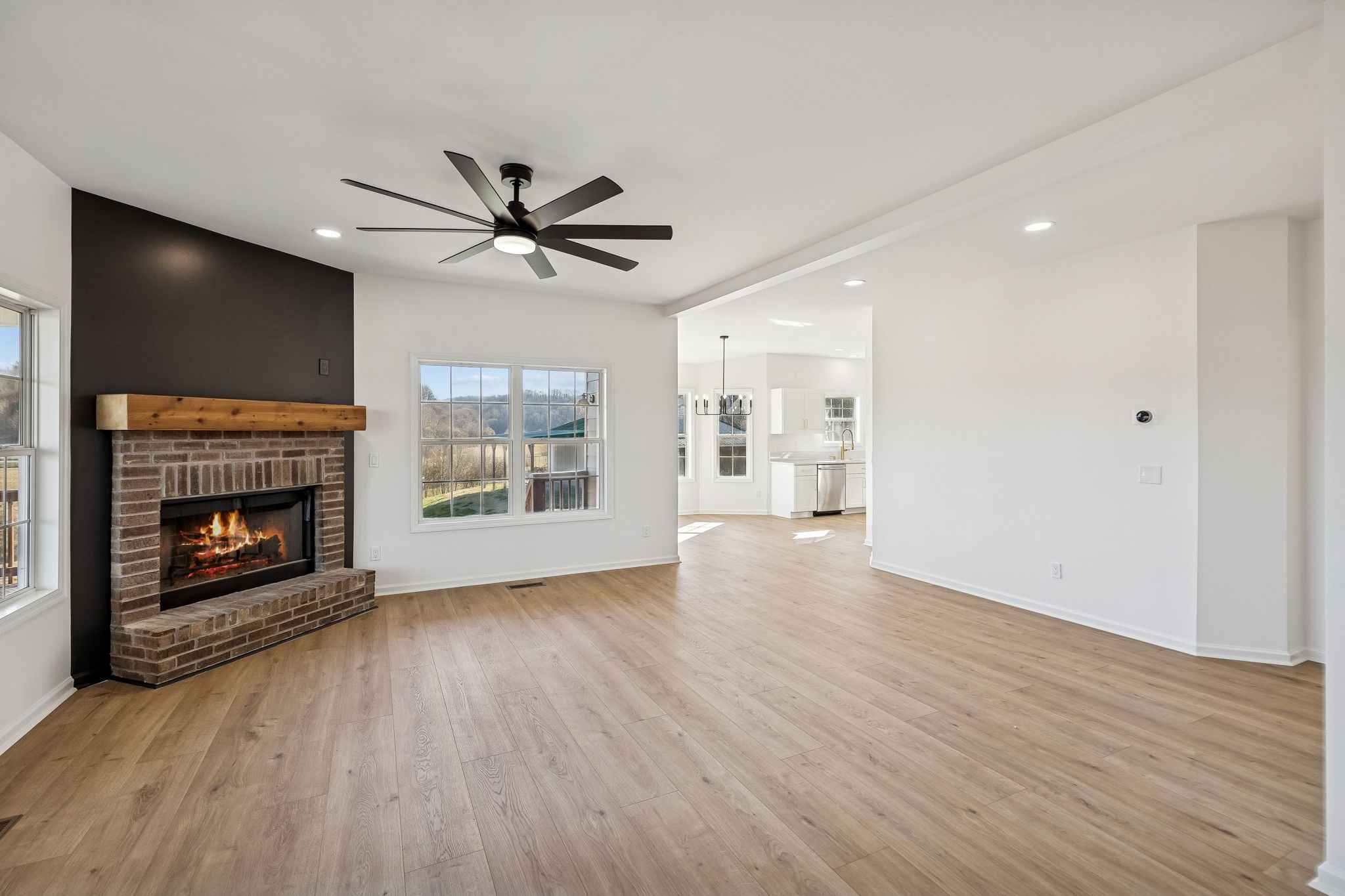 1909 Evergreen Road Thompson's Station, TN 37179 - Photo 10 of 75 a view of a livingroom with a fireplace a ceiling fan and hardwood floor