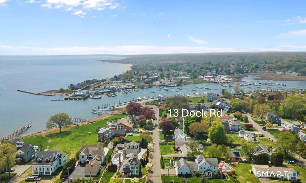 A stunning aerial view of a charming coastal neighborhood centered around 13 Dock Road