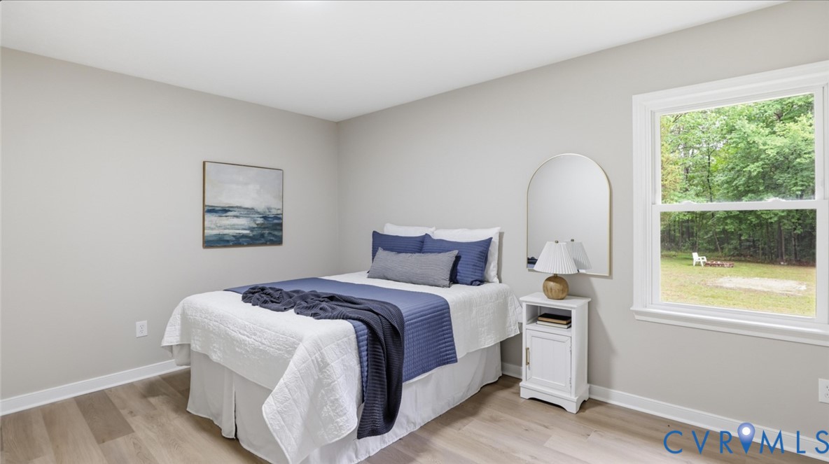 3200 Portugee Road Sandston, VA 23150 - Photo 20 of 26 a bedroom with a bed and a window