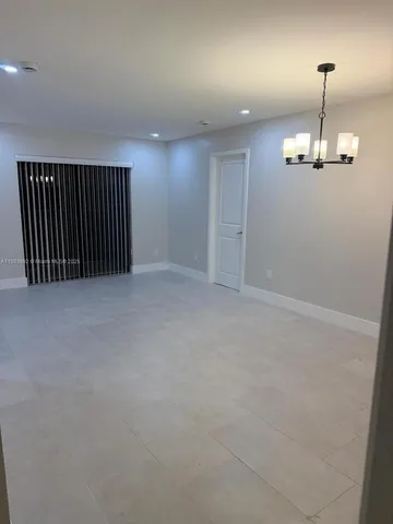 a kitchen with a sink and a stove top oven
